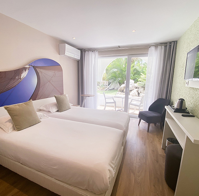 Double bed in the Tribord room at the Hotel Europe, in the Hérault